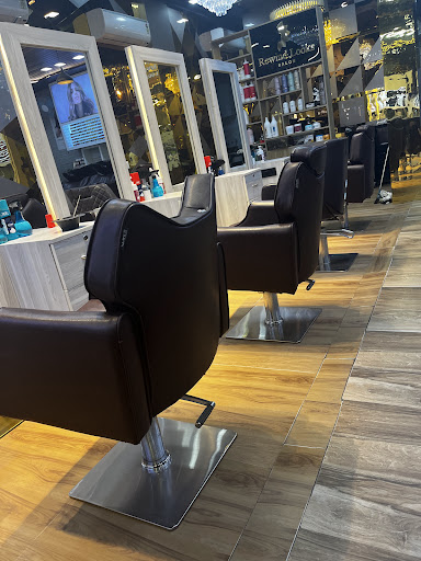 Styling stations with leather chairs and oak floors