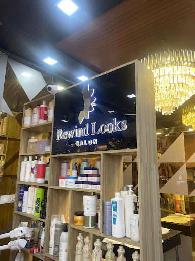 Rewind Looks sign and product shelf under the chandelier